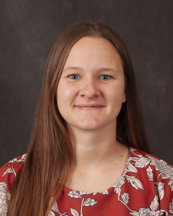 Blonde woman in orange blouse
