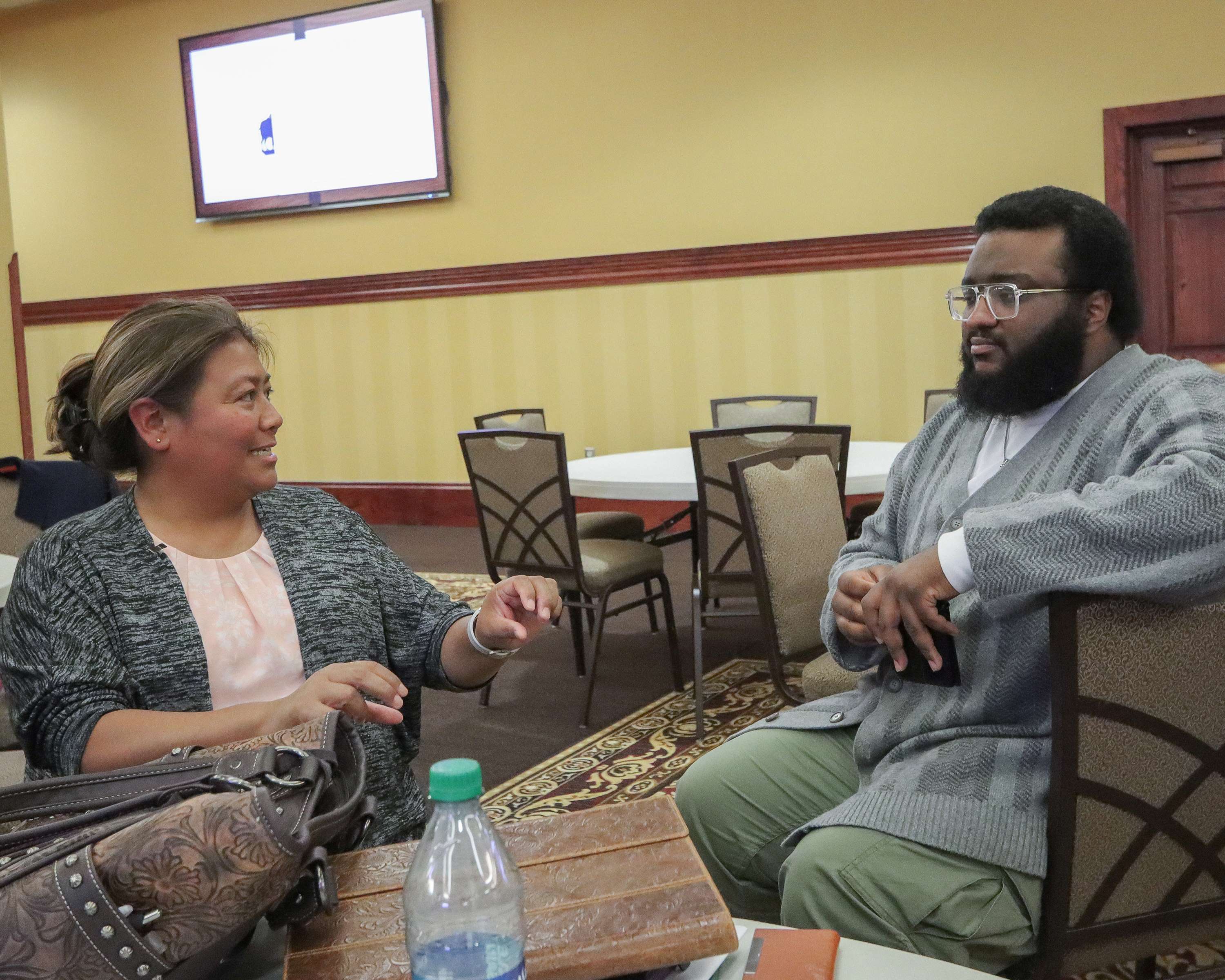 City employee speaking to student.