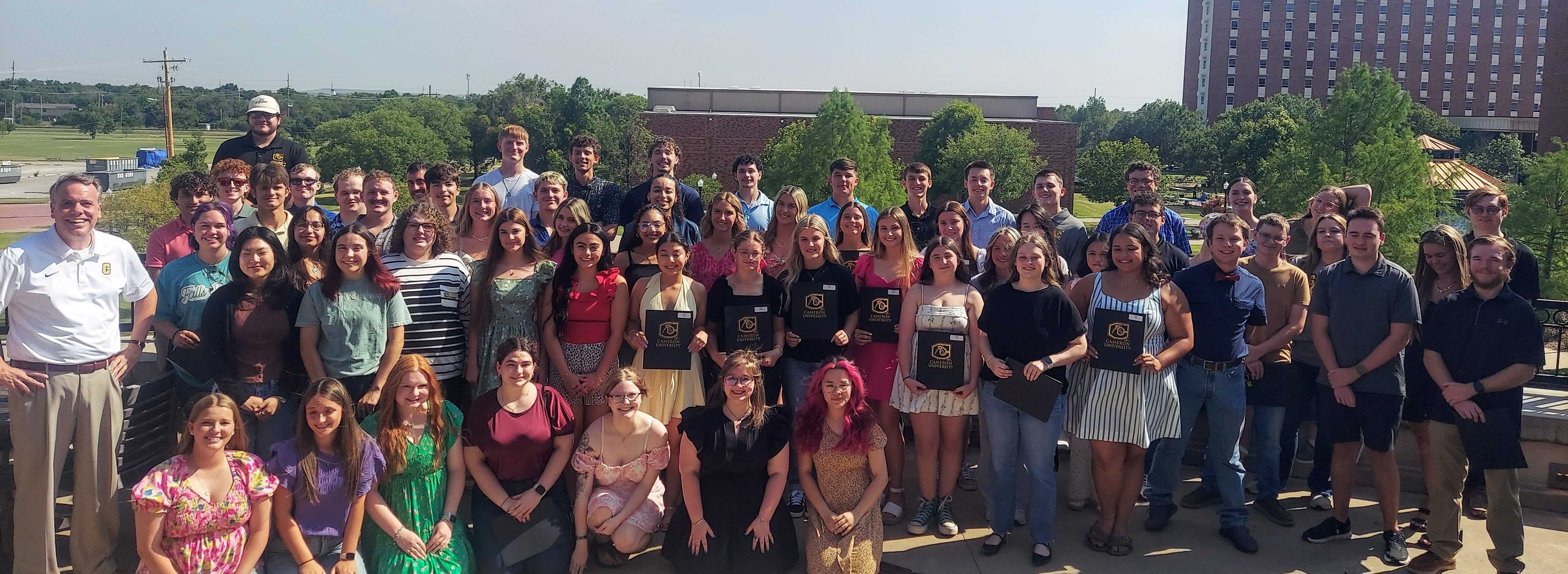 Photo of PLUS students with President Hunt